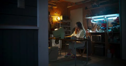 Female Hispanic Developer Using Computer In Retro Garage Stock Footage 256000100
