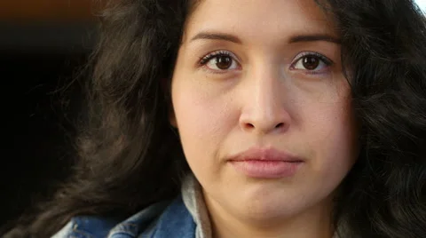 Female hispanic looking at camera, serious Stock Footage 48522000