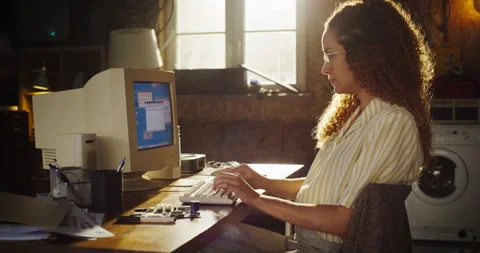 Female Hispanic Programmer Using Computer In Retro Garage Stock Footage 255999001