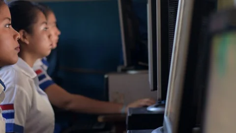 Female hispanic students working in computer class in Guatemalan college Stock Footage 121419917