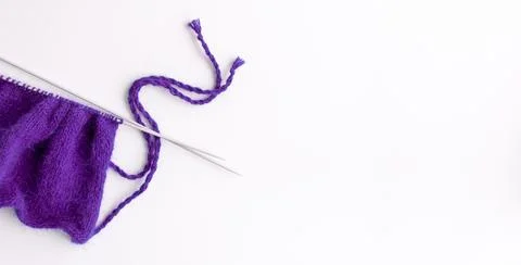 Female hobby knitting. The beginning of the process of knitting a sweater. Stock Photos