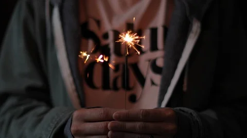 Female Holding Sparkler In Front Of Camera Stock Footage 87053859