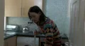 Female at home shouting at someone while she cleans HD Footage