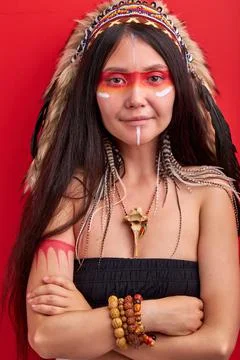 Female in Indian hat looking at camera, trendy color photo Stock Photos