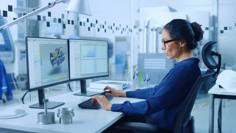 Female Industrial Engineer Solving Problems, Working on a Personal Computer Stock Footage 123634242