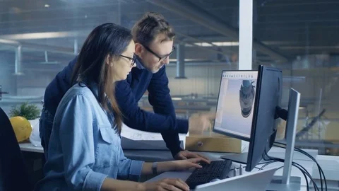 Female Industrial Technician and Male Chief Engineer Designing 3D Turbine Stock Footage