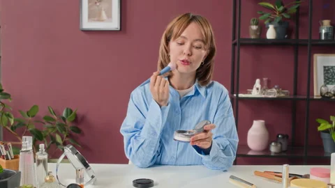 Female Influencer Talking to Camera While Doing her Make-Up Stock Footage 305034657