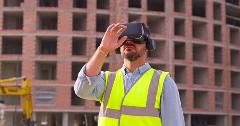 Female inspector analyzing work of builders using virtual reality glasses. Woman Stock Footage 172288952