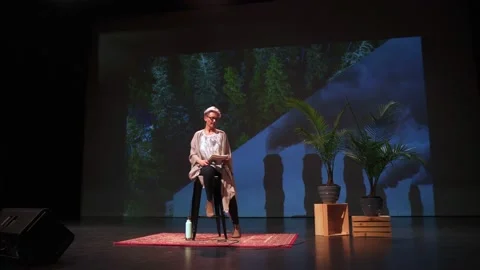 Female inspirational speaker preparing for presentation on environment on stage Stock Footage 220367133