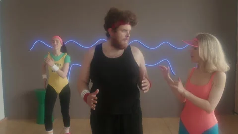 Female Instructor on 80s Aerobics Class | Stock Video | Pond5