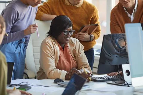 Female IT Developer Enjoying Work with Team 写真素材