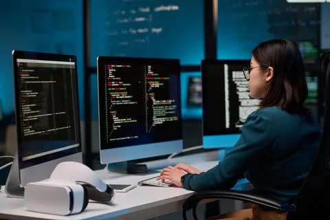 Female IT Developer Writing Code for VR 写真素材