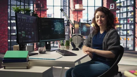 Female IT engineer doing maintenance on artificial intelligence systems Stock Footage 308597559