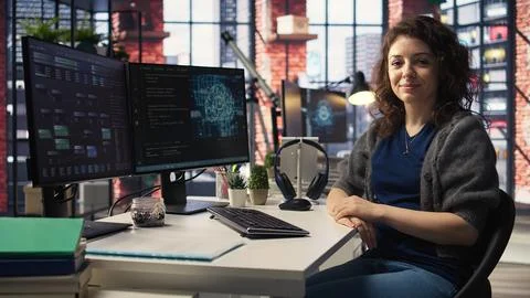Female IT engineer doing maintenance on artificial intelligence systems Stock Photos