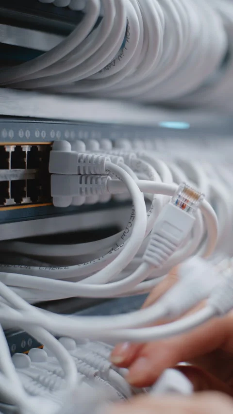 Female IT Engineer Inspecting Server Rack Cabling and Ethernet Connections Stock Footage 344958263