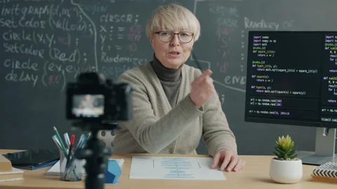 Female IT expert recording tutorial on software language speaking and showing Stock Footage 204092724