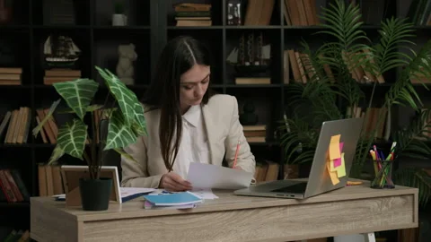 Female IT programmer analyzes a task she has to complete. Woman in classic suit Video stock 305373235