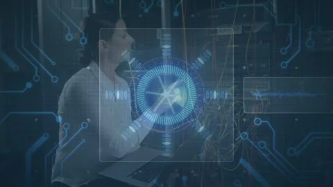 Female IT tech inspecting rack cables in server room, tracing ports using laptop Stock Footage 333904997