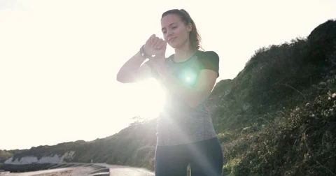 Female jogger checking smart watch Stock Footage 81950401