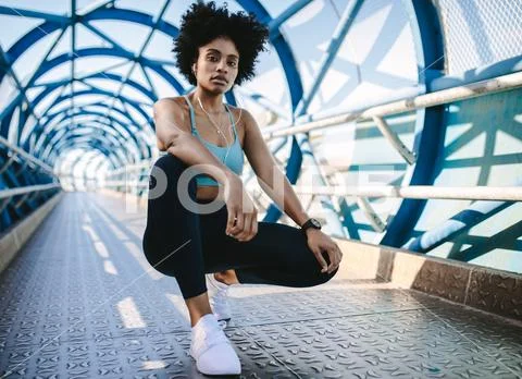Female jogger taking a break Stock Photos