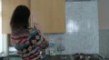 Female in kitching starting dinner HD Footage