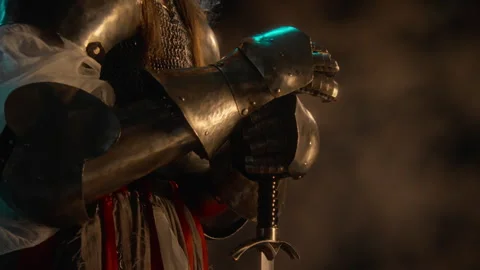 Female Knight in Armor Holding Sword for Historical Reenactment Stock Footage 345516853