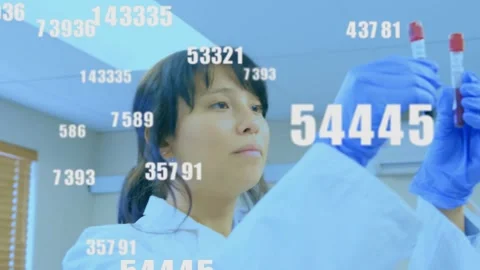 Female lab worker comparing two blood tubes for ID check, camera shifting and 库存影片 330356526