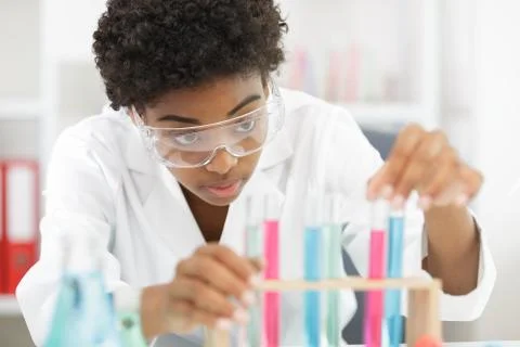 Female lab worker doing tests in a laboratory Stock Photos