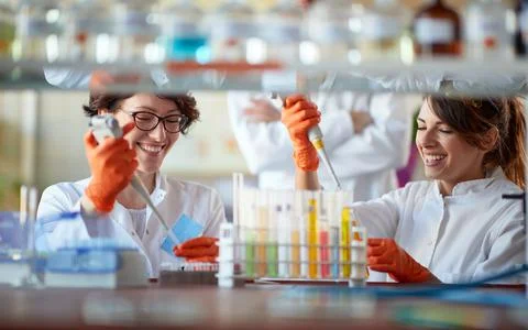 Female laborants analyzing samples together Stock Photos