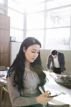 Female land use planner using digital tablet in office Foto stock