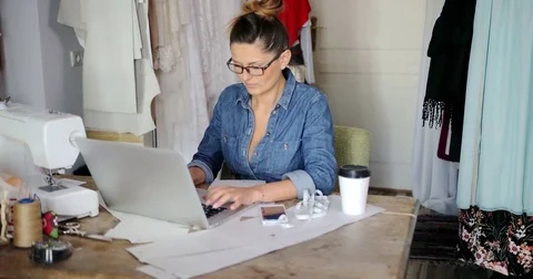 Female with laptop in parlour Stock Footage