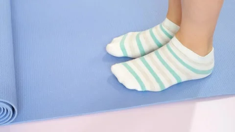 Female legs doing exercises lifting on toes close-up on pink background. Stock Footage 244362698