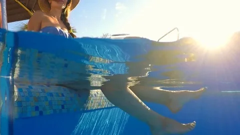 Female legs in the pool Stock Footage 84092583