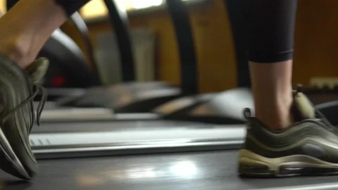 Female legs running on treadmill machine in gym, purposeful woman, goal. Slow Stock Footage 108971965