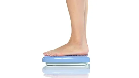 Female legs step down from the scales Video stock 134522189