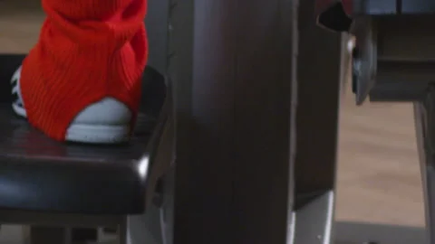 Female legs working out on exercise machines in the gym close-up Stock Footage 231745986