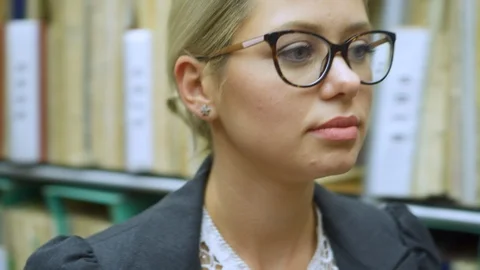 Female librarian working at the library Video stock 97934313