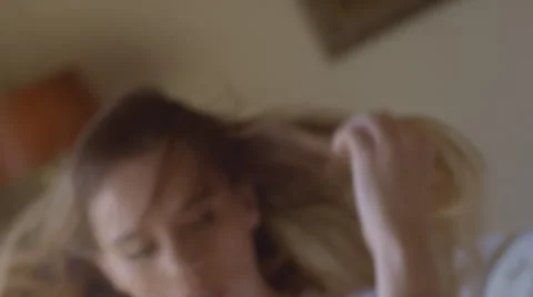 Female long haired brunette model poses in slow motion 動画素材 45786232
