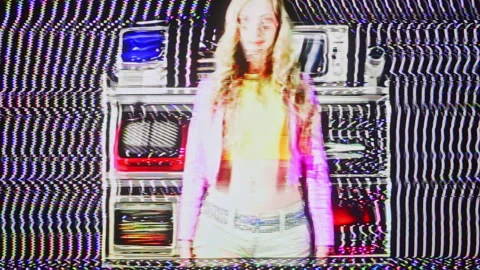 Female looking around with a wall of glitching television screens Stock Footage 305458129