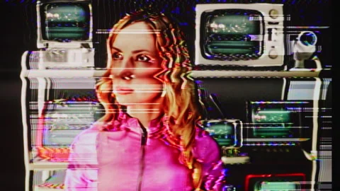 Female looking around with a wall of glitching television screens Stock Footage 305459256
