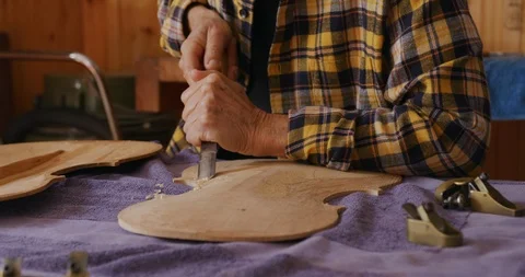 Female luthier at work in her workshop | Stock Video | Pond5