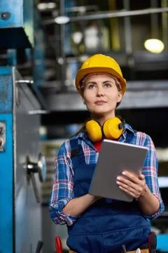 Female Machine Operator Focused on Work Stock Photos