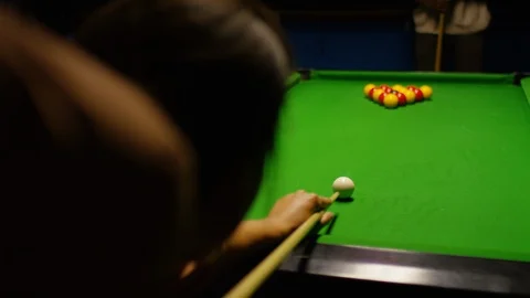 Female making a break on a billiards table in a pool hall Stock Footage 104691743
