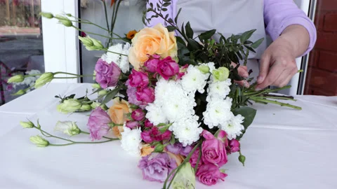 Female making flower arrangement. Stock Footage 188052425