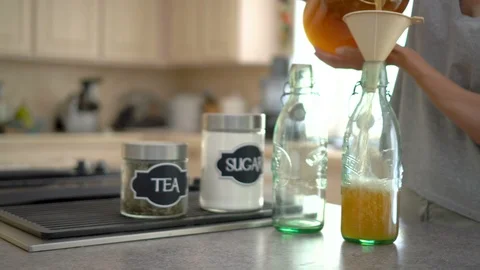 Female making kombucha tea in the kitchen Stock Footage 92048103