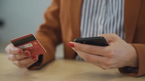 Female making online shopping using smartphone and bank card Stock Footage 113665110