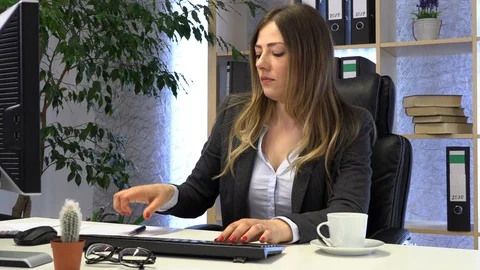 Female manager drinking coffee at work Stock Footage 108387298