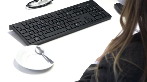 Female manager drinking coffee at work Stock Footage 108479251