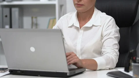 Female manager ending workday, feeling lower back pain, sedentary lifestyle Stock-Footage 117389296