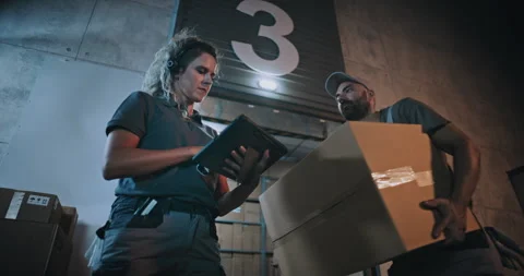 Female Manager Scanning Parcels, Using Digital Tablet. Diverse Employees 스톡 동영상 313345160